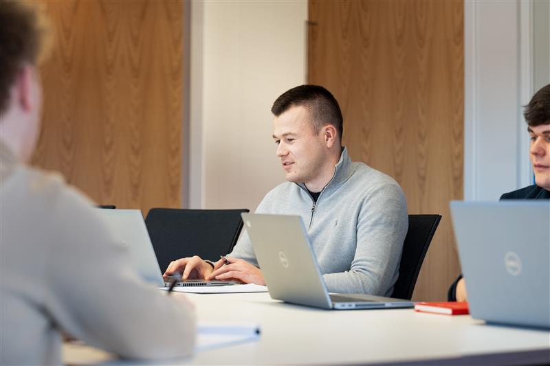 Employee from JCCA on laptops