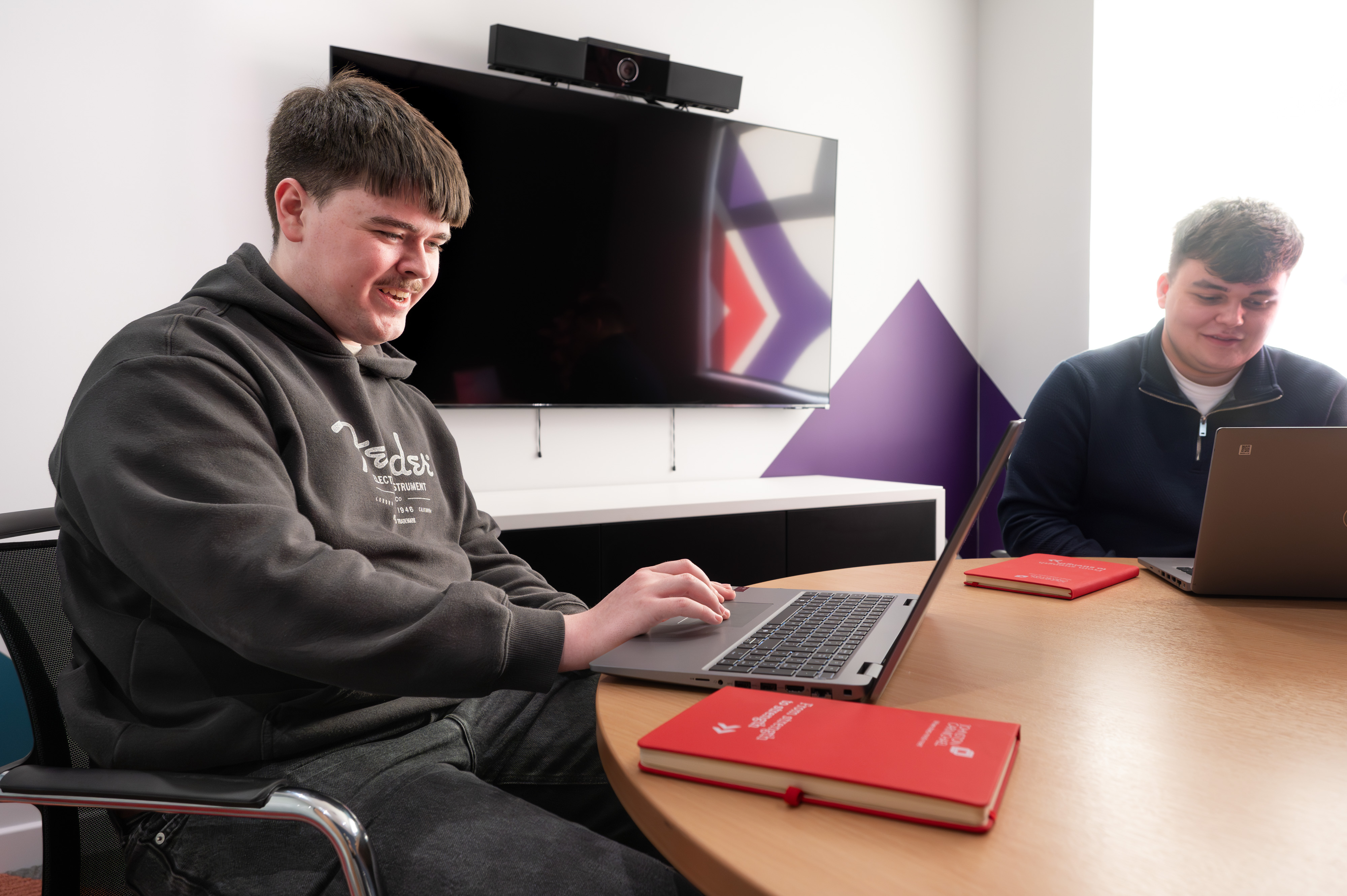 brodie discussing work with a peer brodie discussing work with a peer